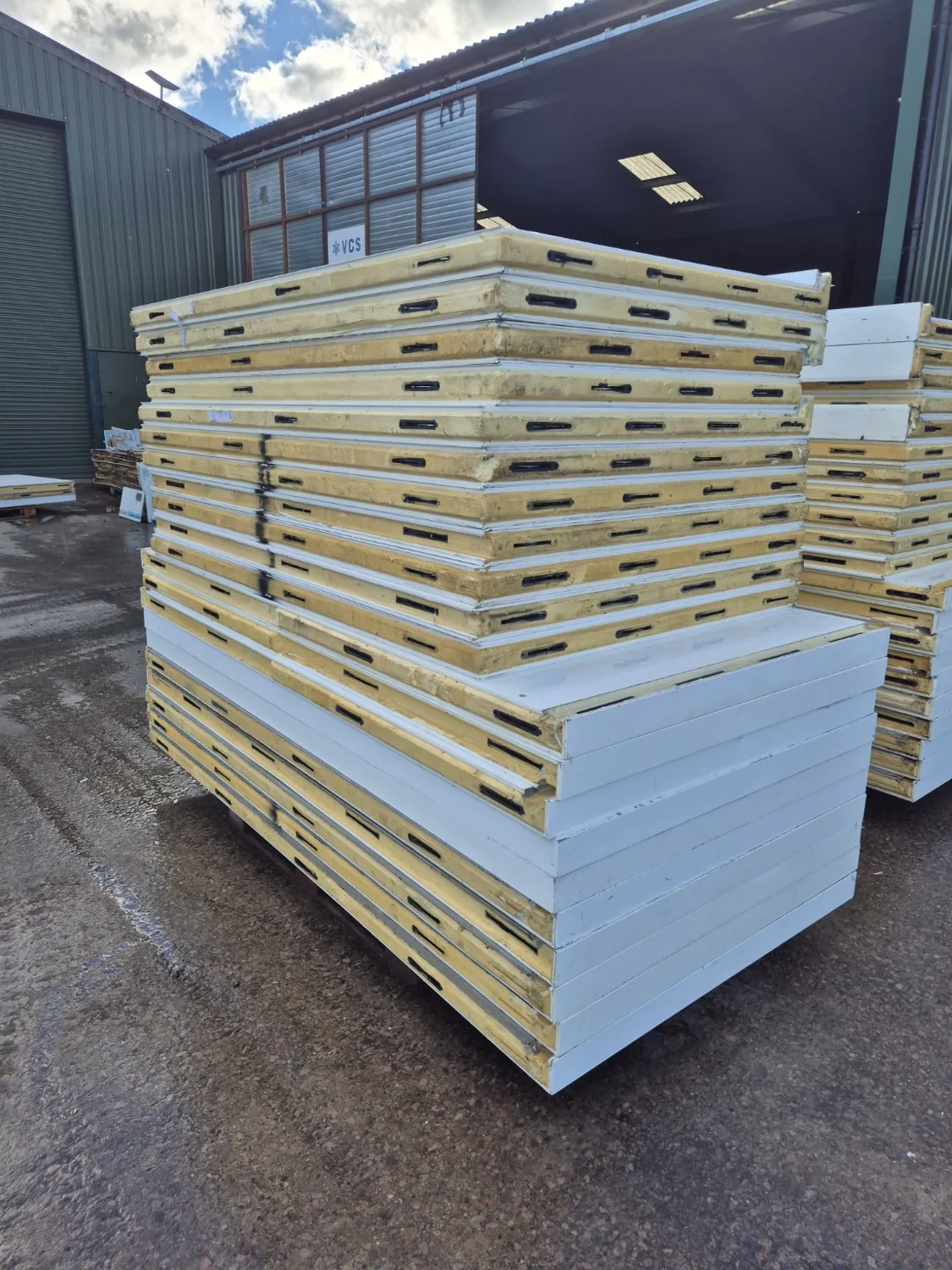 Insulated modular cold room panels stacked at the VCS yard ready for transport