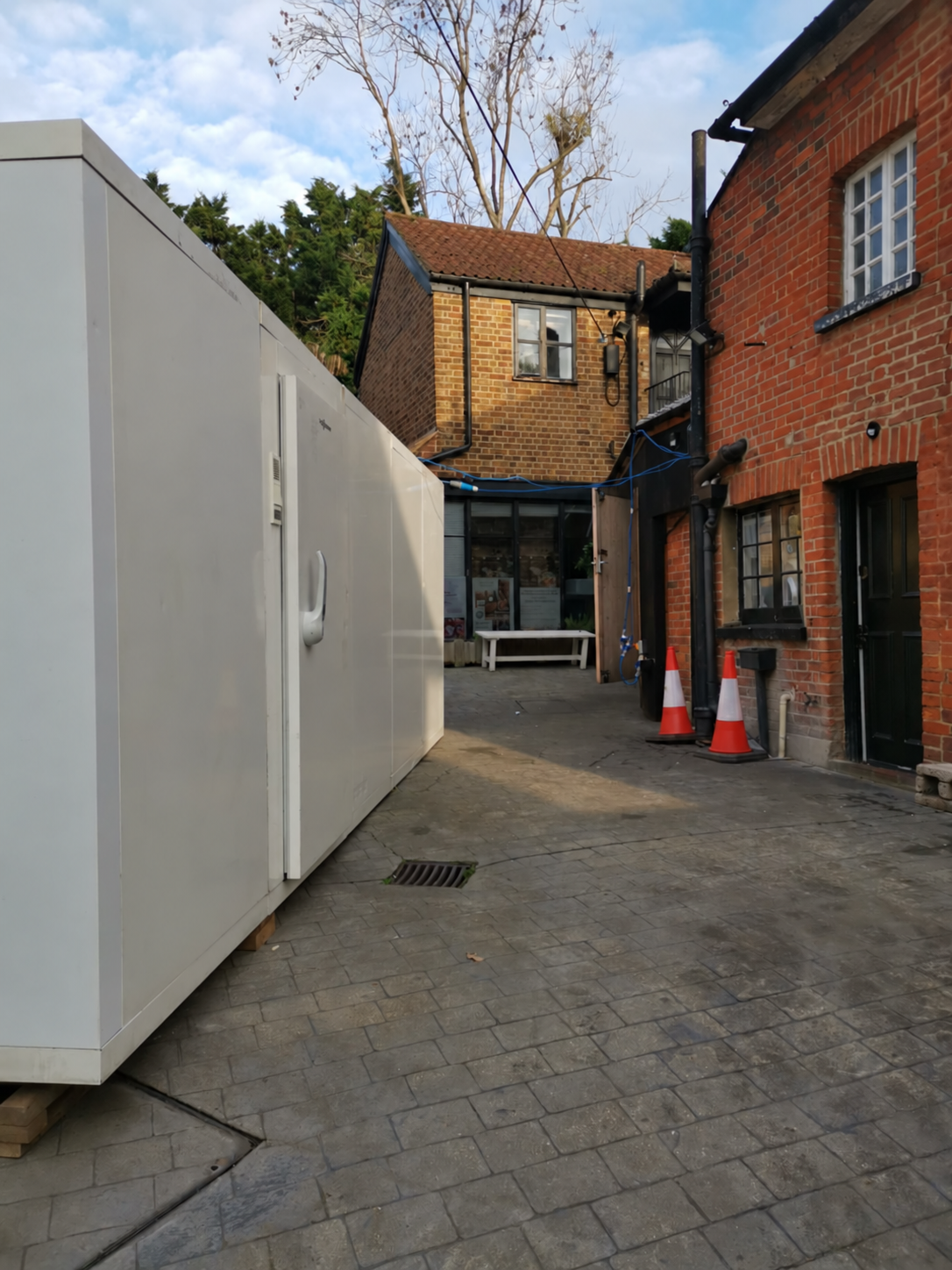 VCS temporary cold room installed in a paved courtyard beside a butcher’s premises