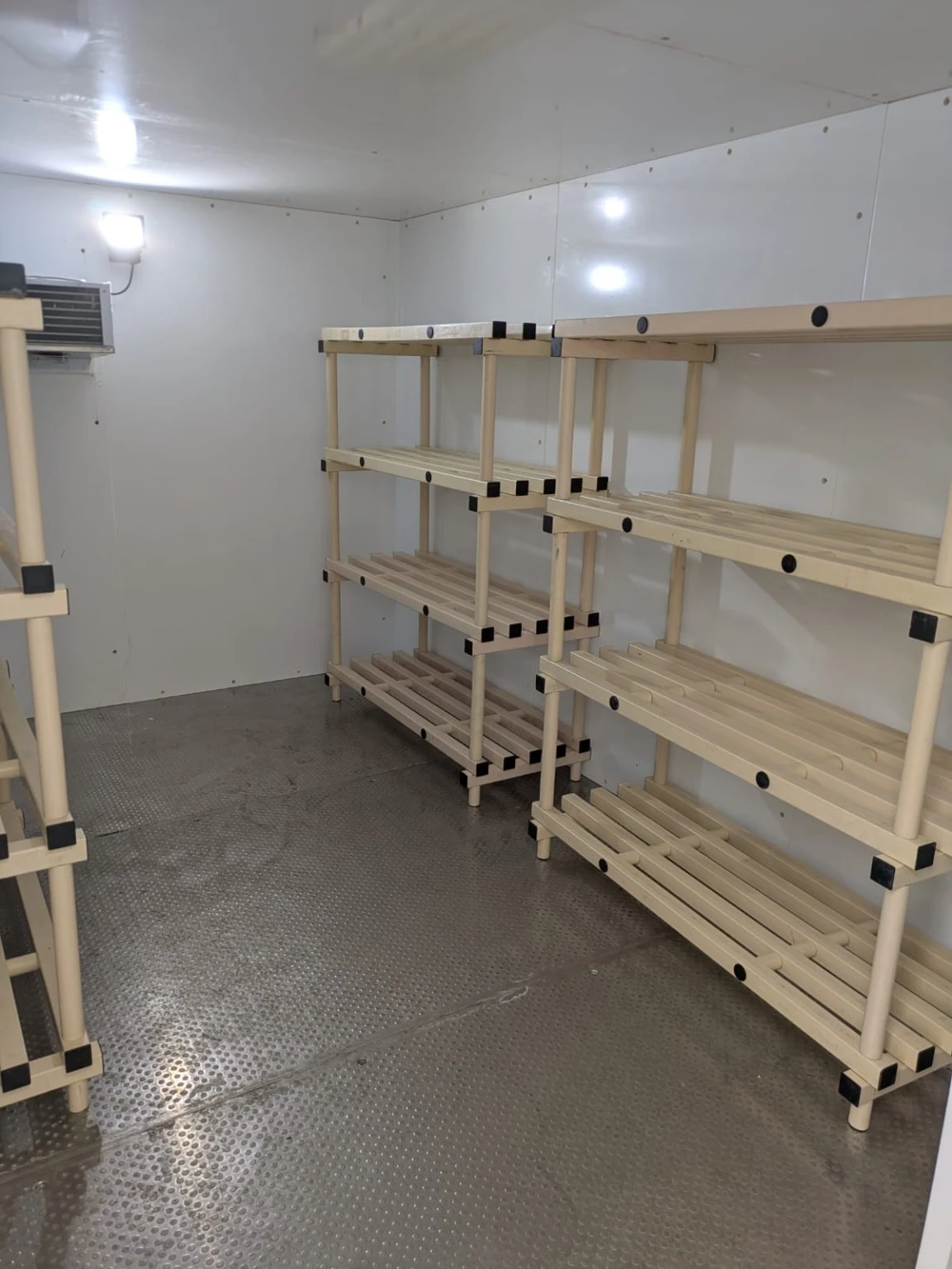Clean cream-coloured racking inside a VCS cold room at The Honourable Society